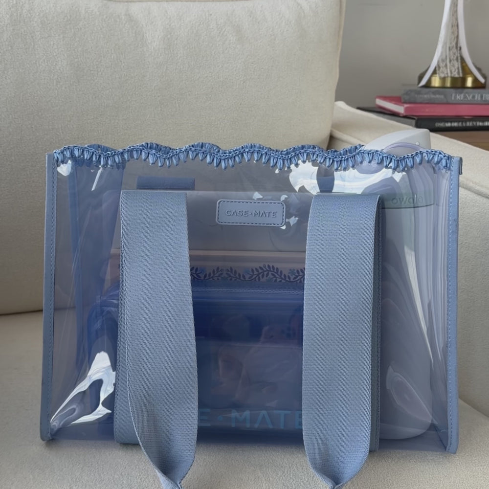 A woman showing off her medium jelly tote
#color_carolina blue crochet wave