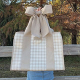 Woman showing off her latte gingham bow jelly tote
#color_latte gingham bow