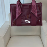 Packing Mulberry Twilly Scarf Tote with Mulberry organizer full of various items.
#color_mulberry