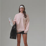 A woman showing off her Midnight Black Jelly Tote with a water bottle
#color_midnight black