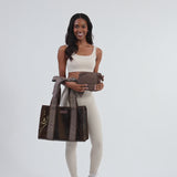 Woman showcasing Espresso Polka Dot Bow Jelly Tote + Crinkle Bag #color_espresso polka dot bow