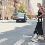 A woman showing her silver chrome crossbody tote bag in new york city
#color_silver chrome