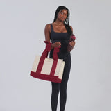 a woman showing her canvas cranberry tote bag
#color_cranberry bow