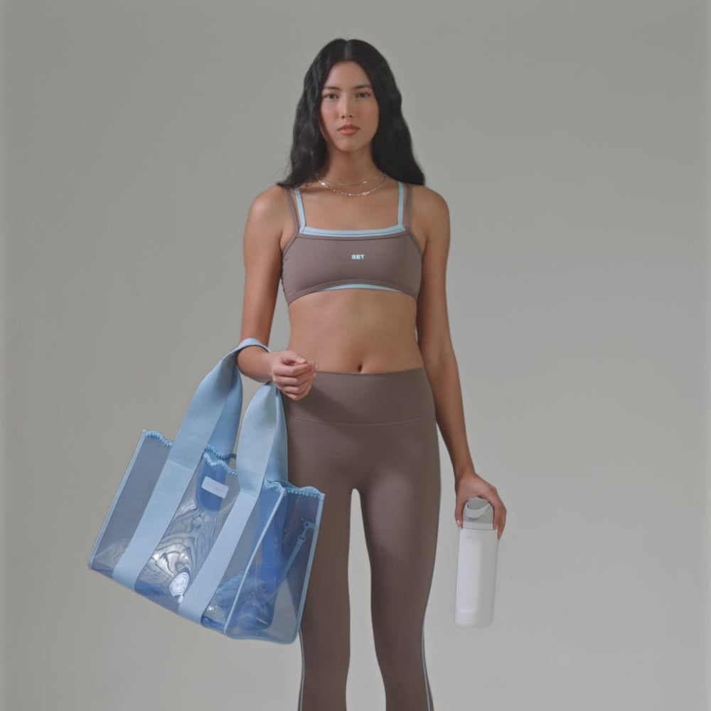 A Woman showing her carolina blue crotchet wave jelly tote bag
#color_carolina blue crochet wave