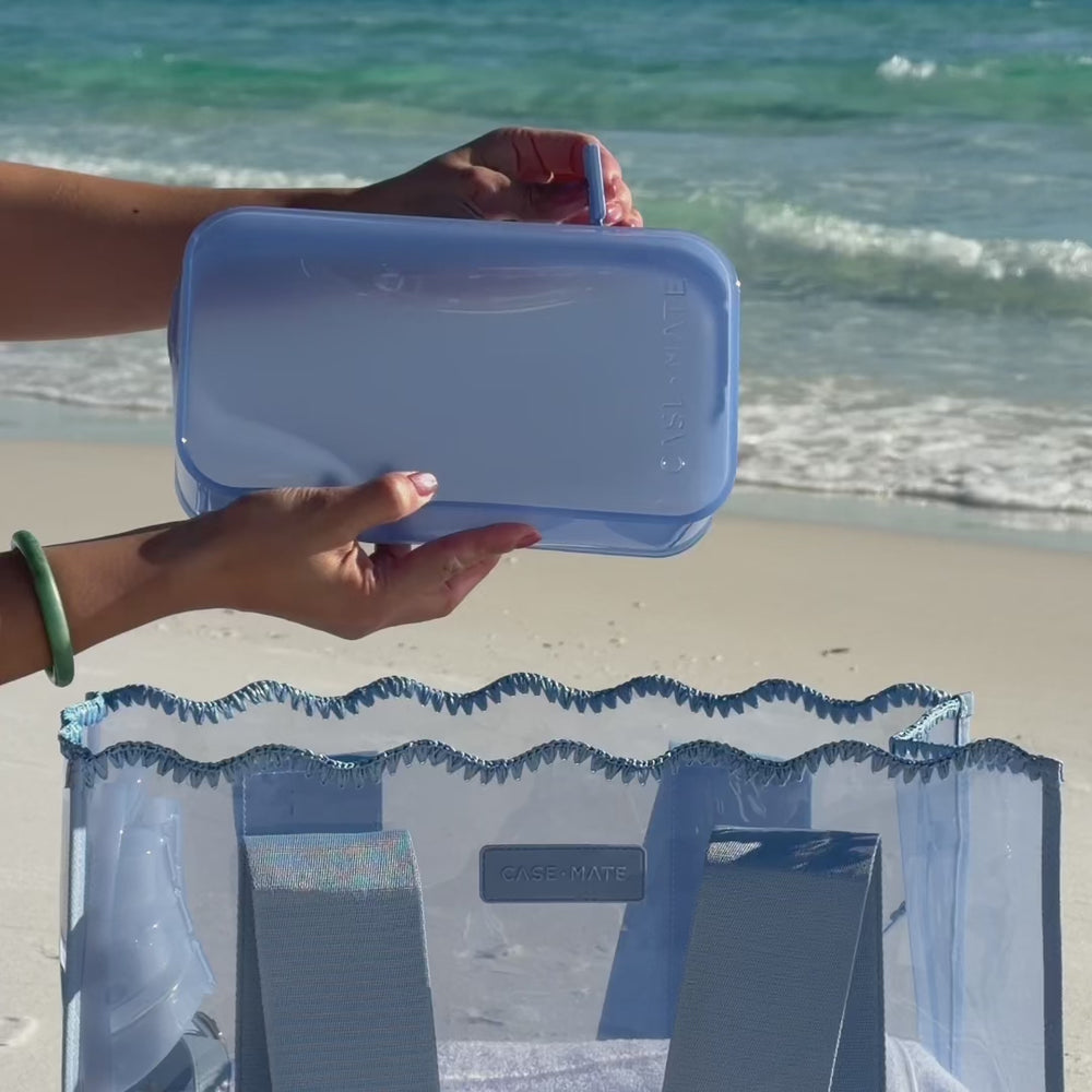 Video of someone packing the Carolina Blue jelly makeup bag on the beach