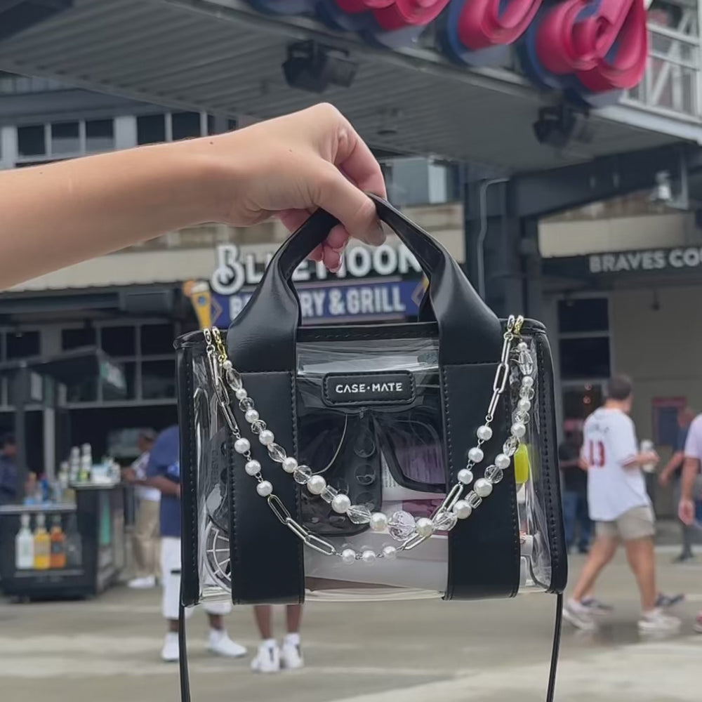 Girl at a baseball game using her Stadium Jelly Tote to pack all her essentials. 
#color_midnight_black