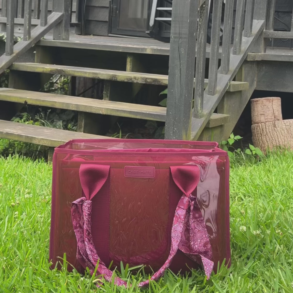 Video packing Mulberry Jelly Makeup Bag with various cosmetic products in a grassy scenery
#color_mulberry