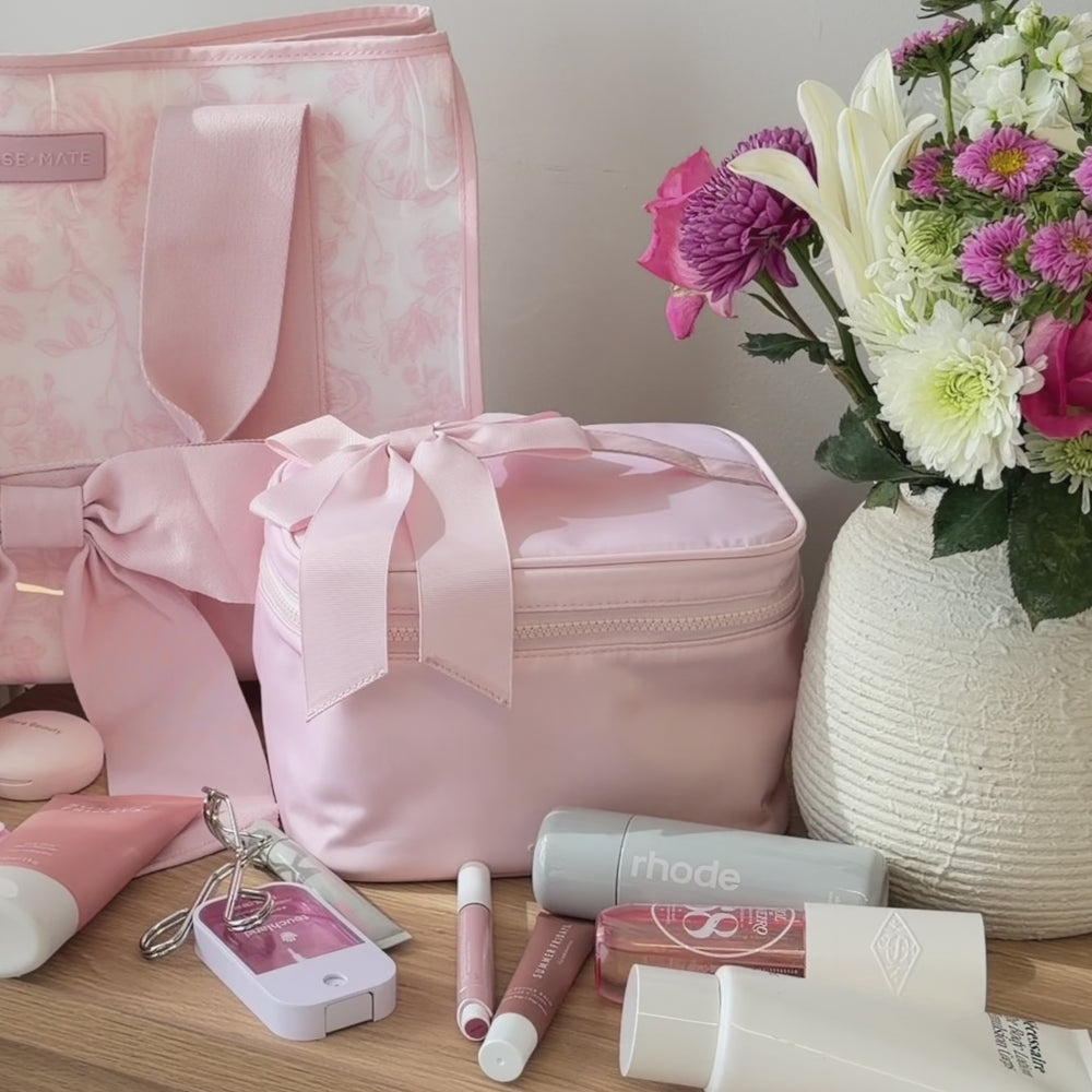 A Case-Mate Train Case being packed with make-up