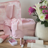 A Case-Mate Train Case being packed with make-up