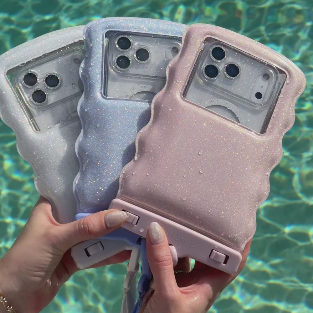 A waterproof floating pouch being shown in a pool #color_ballet pink twinkle