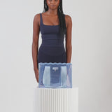 A woman showing off her medium jelly tote
#color_carolina blue crochet wave