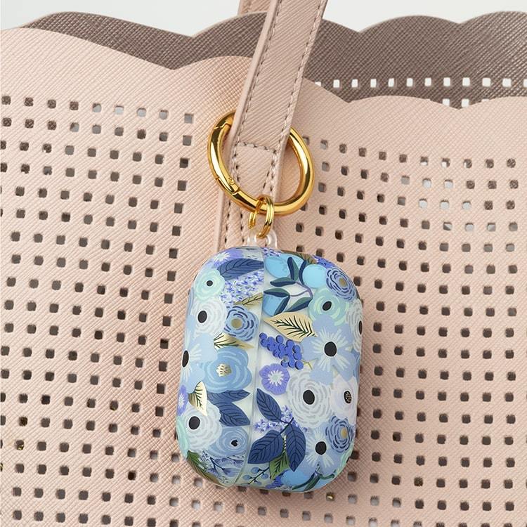 Rifle Paper AirPods Pro case hooked onto purse. color::Garden Party Blue