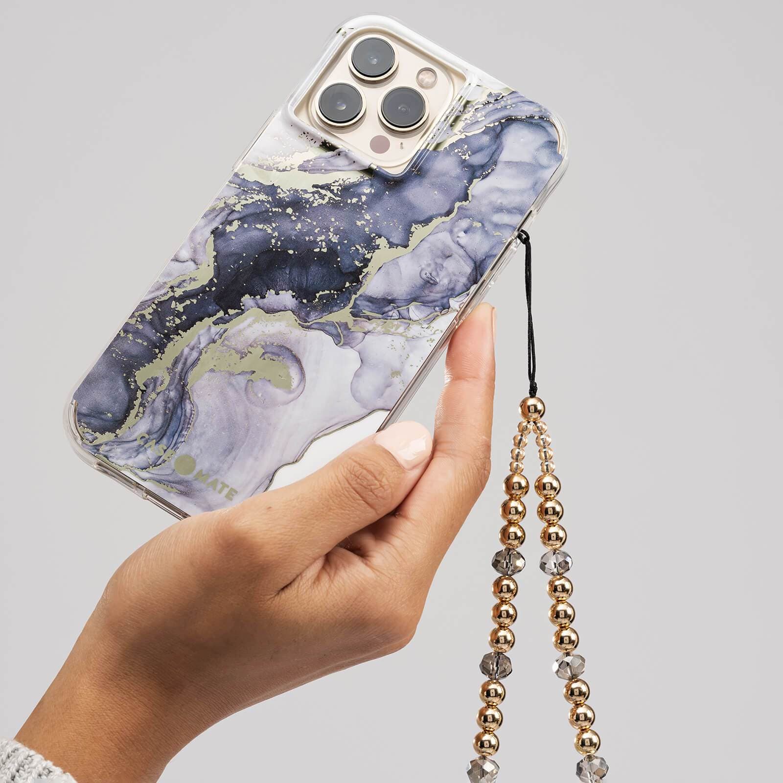 Navy Marble case on iPhone 13 Pro with Gold phone charm. color::Navy Marble