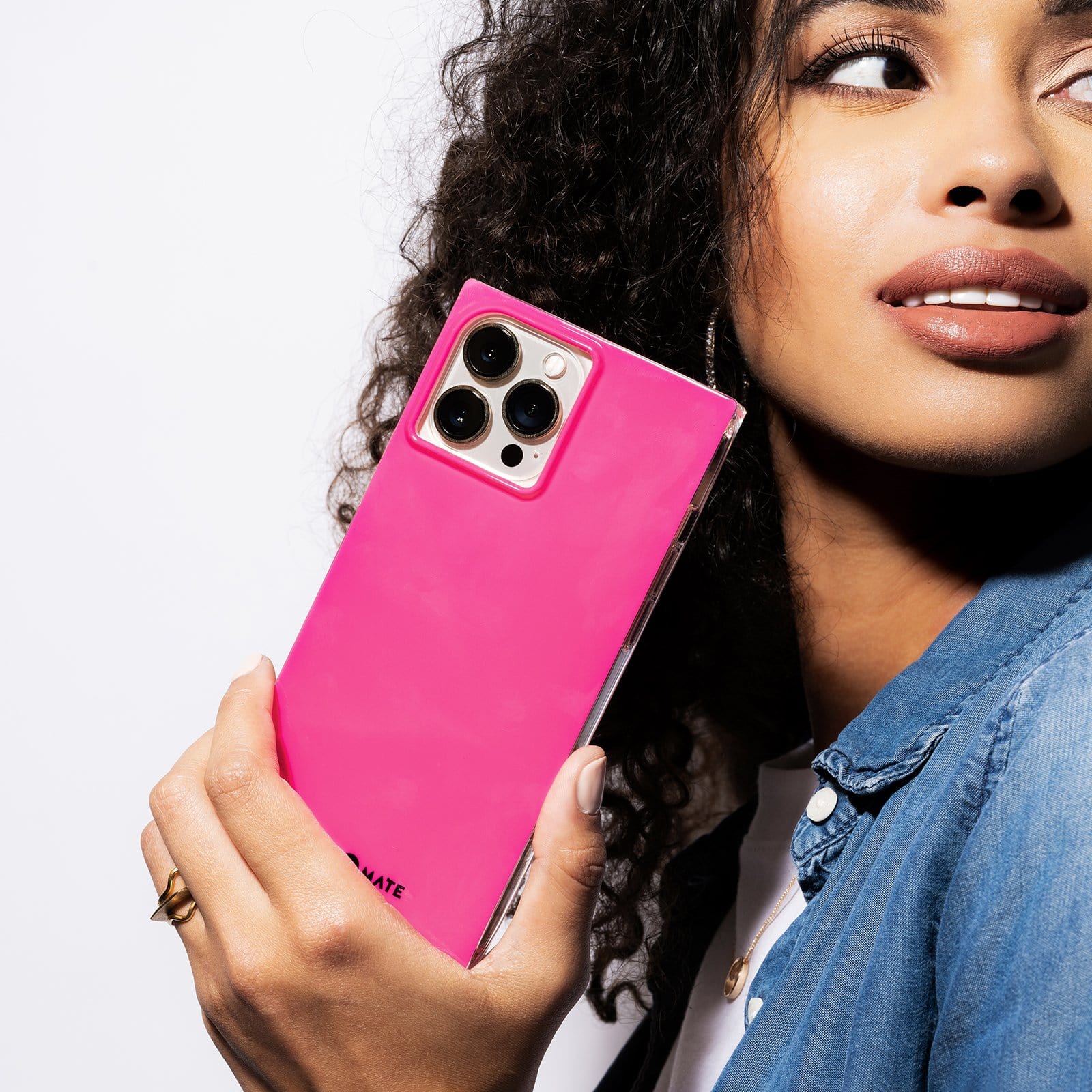 Woman holding Hot Pink square case for iPhone 13 pro. color::Hot Pink