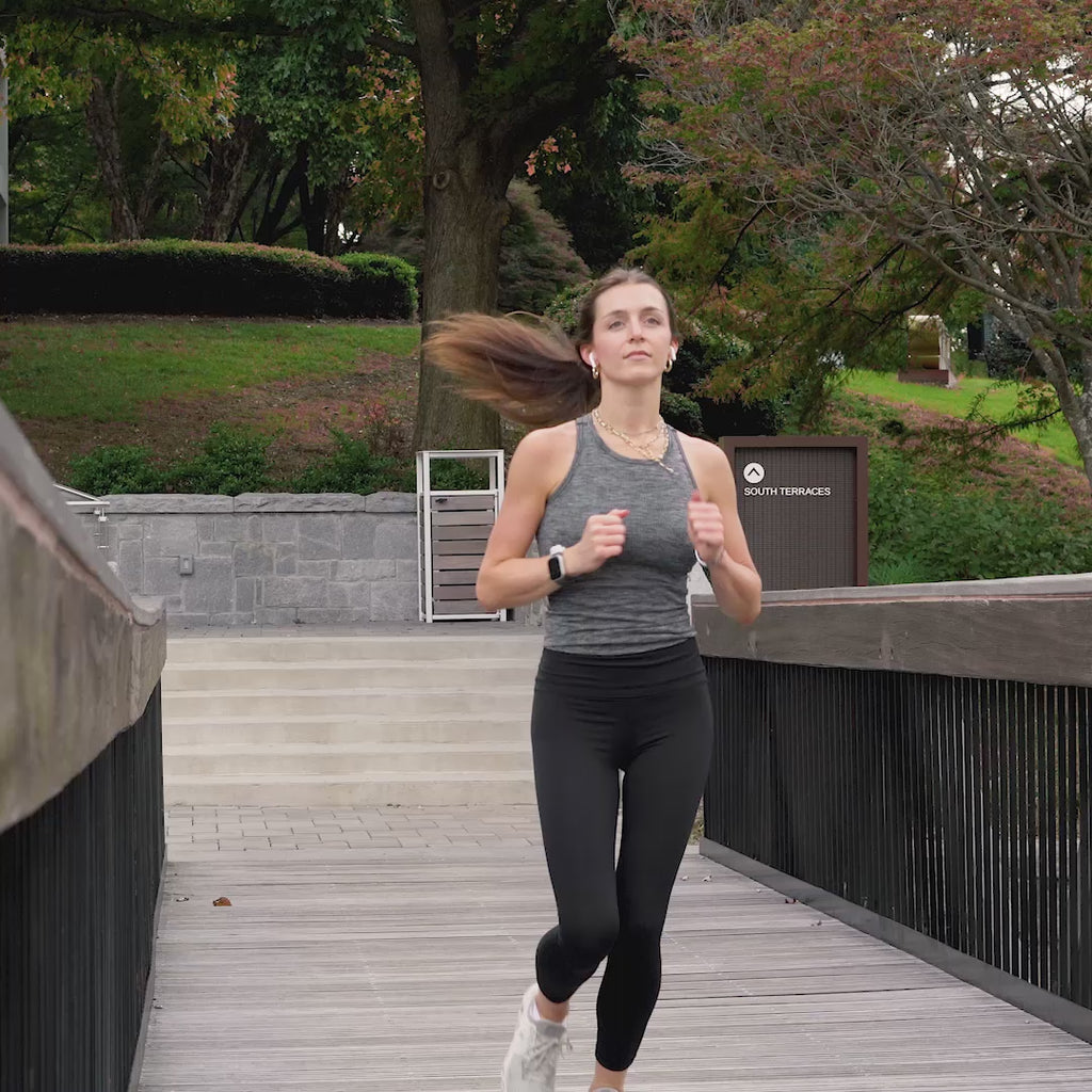 GIRL RUNNING WITH AIRPODS WATCH BAND HOLDER.