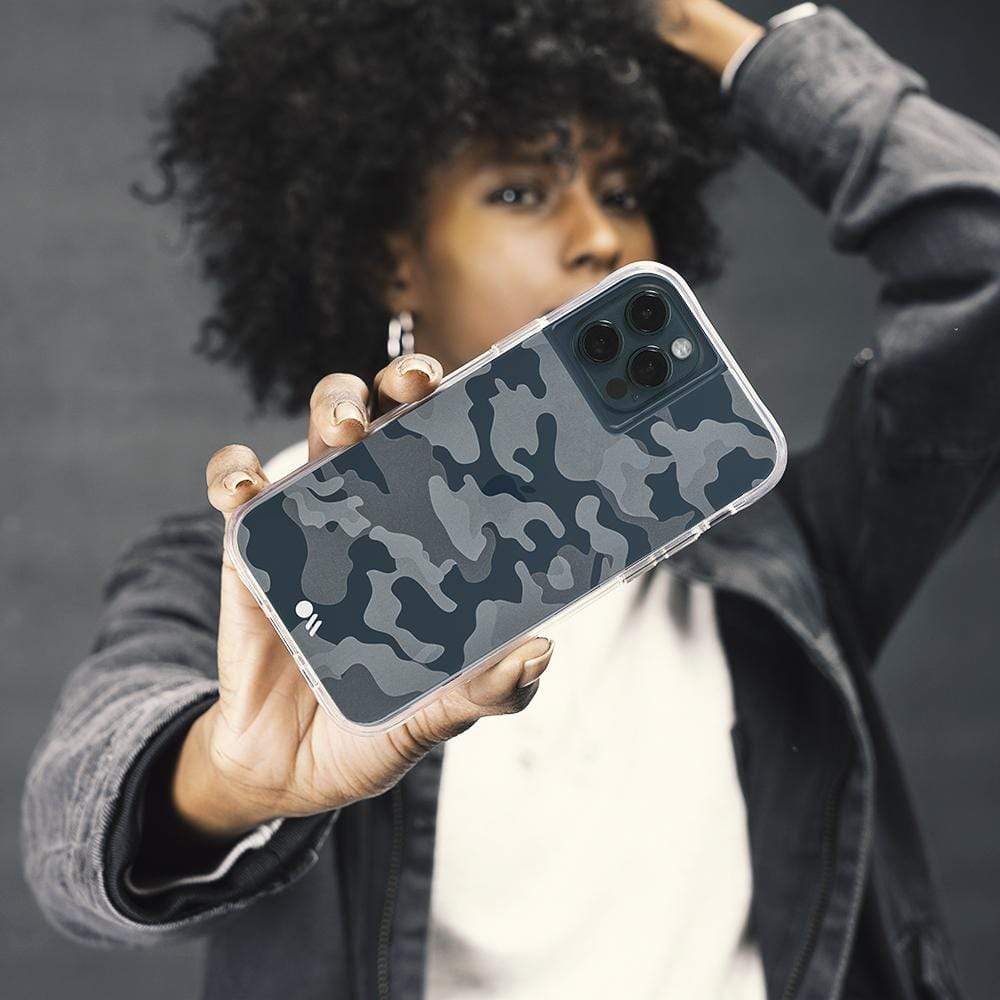 Woman holding partially clear camo case. color::Clear