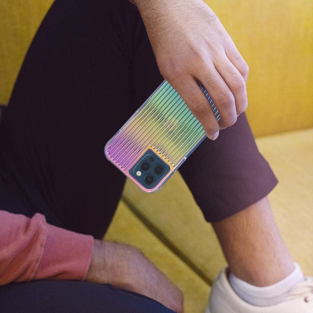 Hand holding Iridescent case with ridges. color::Iridescent