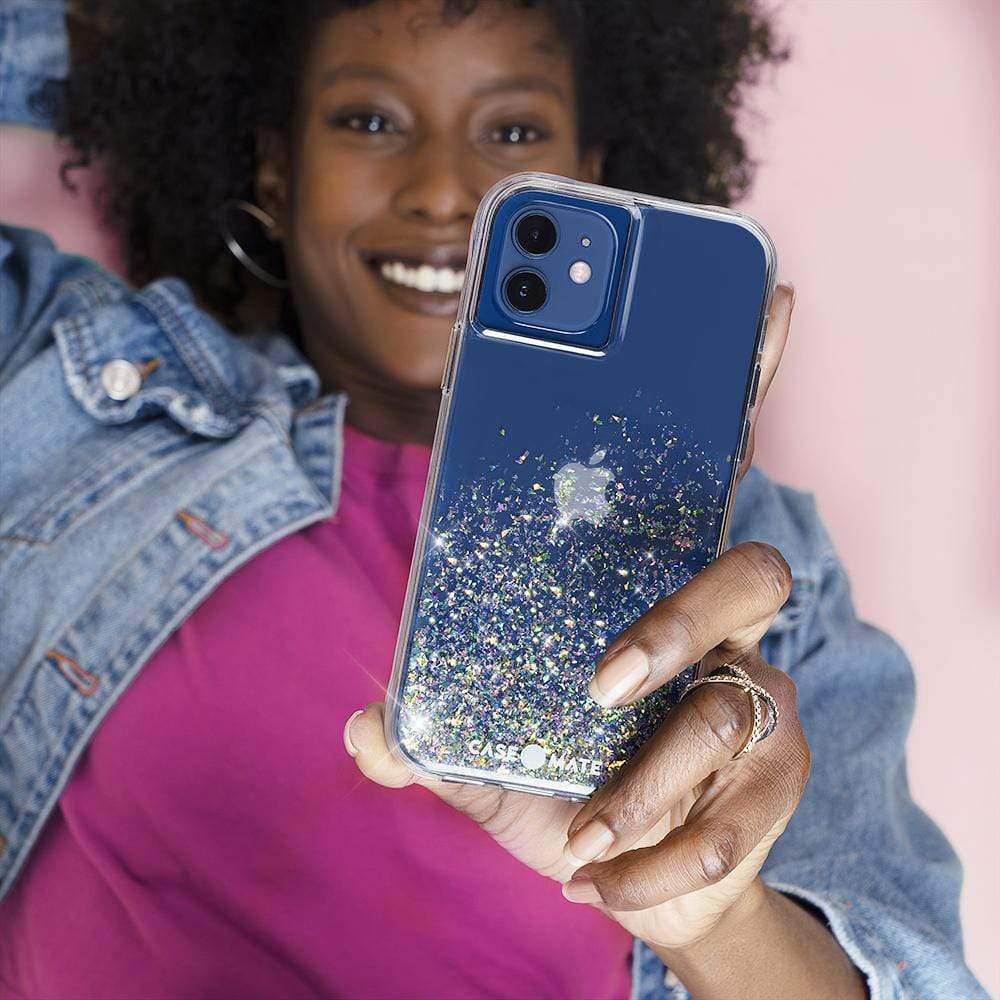 Woman holding case. color::Twinkle Stardust