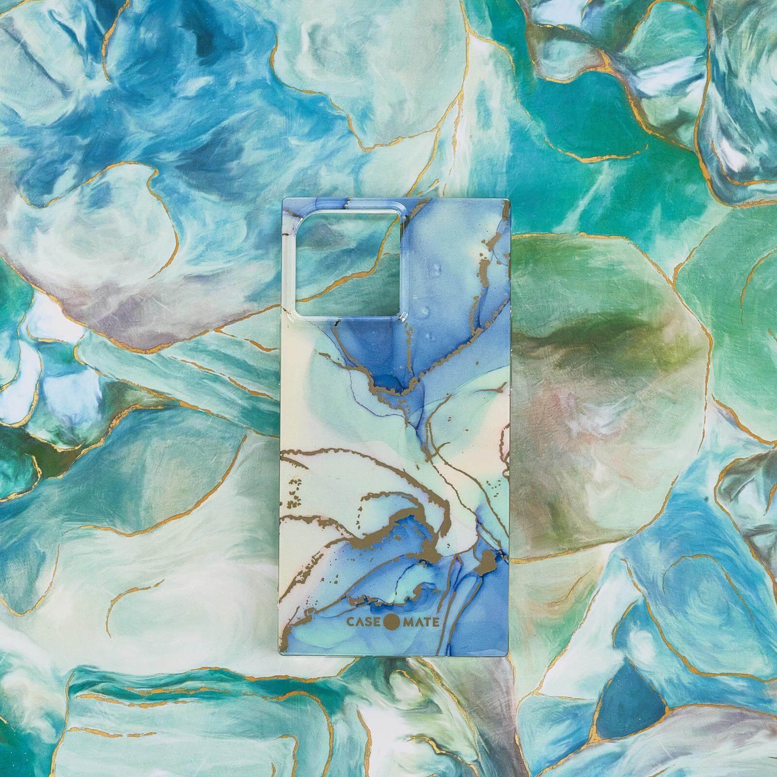 Glacier Marble BLOX for iPhone 13 on blue and green patterned background. color::Glacier Marble