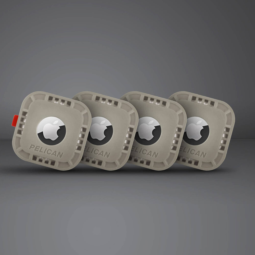 Four grey square AirTag protective cases with adhesive backing and Apple logo cutouts, arranged in a row.