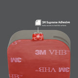 Four grey adhesive AirTag sticker mounts with 3M Supreme adhesive backing shown mounted on red adhesive pad.