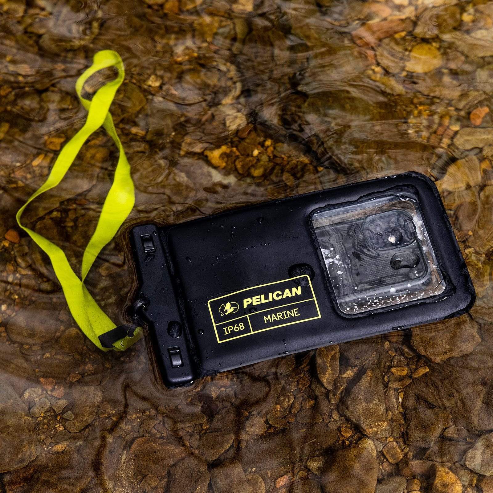 Waterproof pouch XL in stream of water. color::Black/Hi Vis Yellow