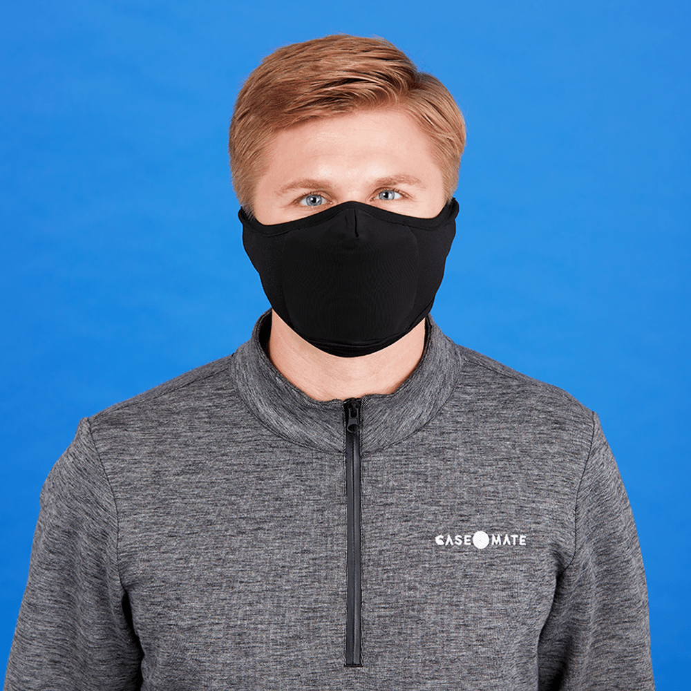 Man wearing warm fleece face mask. color::Black