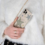 Hand holding Sheer superstar case. color::Sheer Superstar