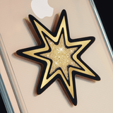 Magnetic car charm stuck to iPhone case. color::Gold Star