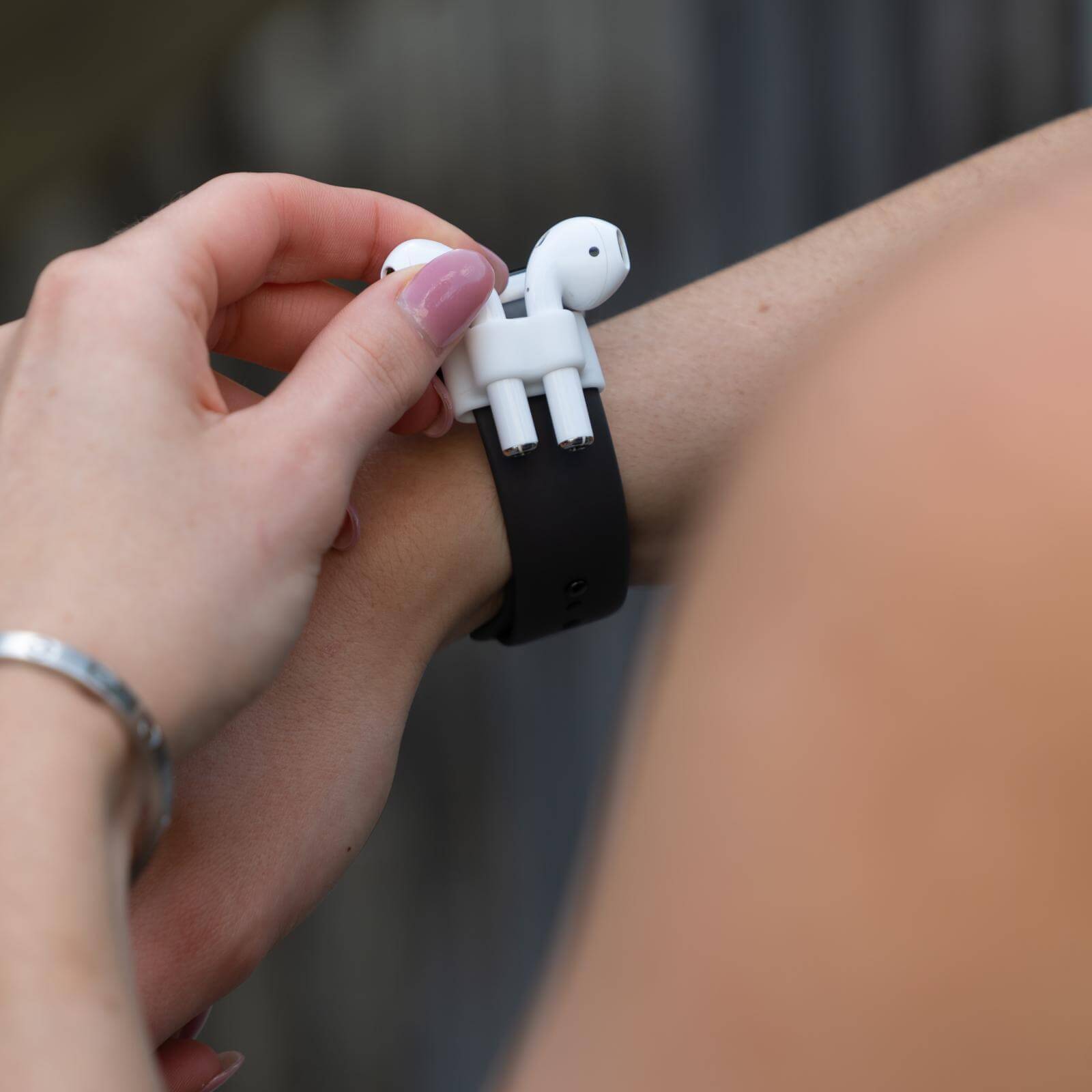 AirPod holder attaches to Watch Band Strap. color::White