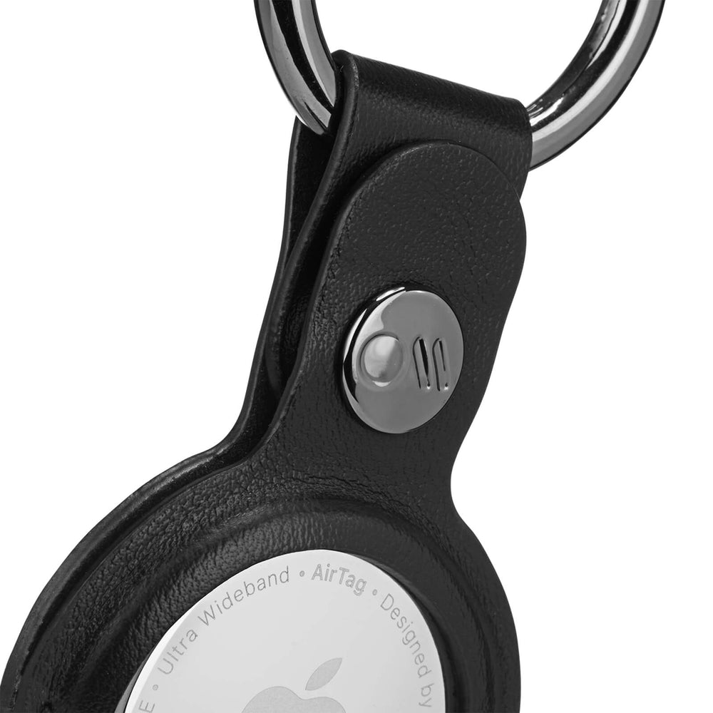Up close of silver hardware on AirTag Keychain Case. color::Black
