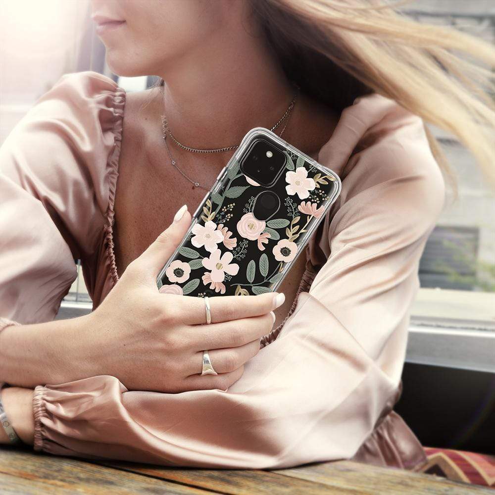 Woman holding Samsung Rifle Paper case. color::Wild Flowers