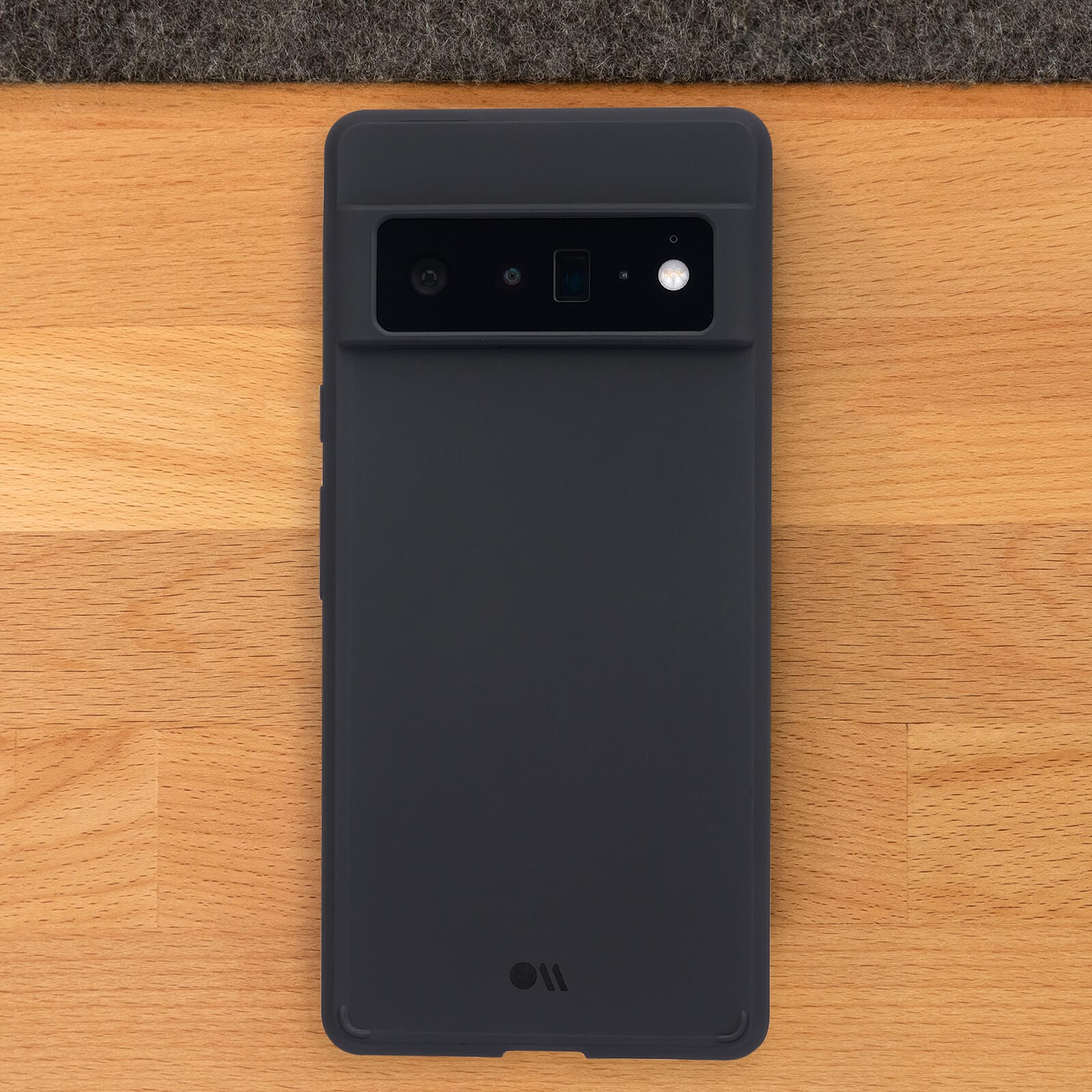 Tough Black Pixel 6 Pro case on wooden background. color::Black