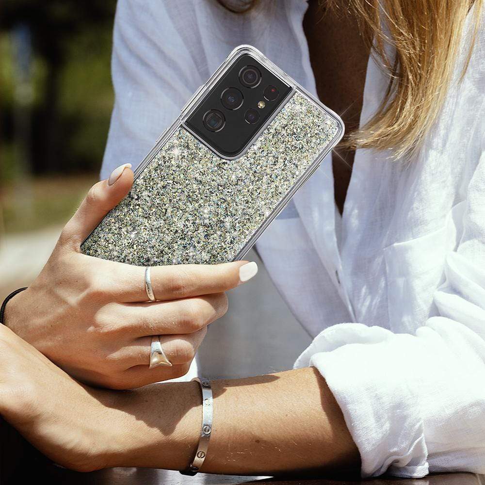 Woman holding sparkly Galaxy S21 Ultra 5G. color::Twinkle Stardust