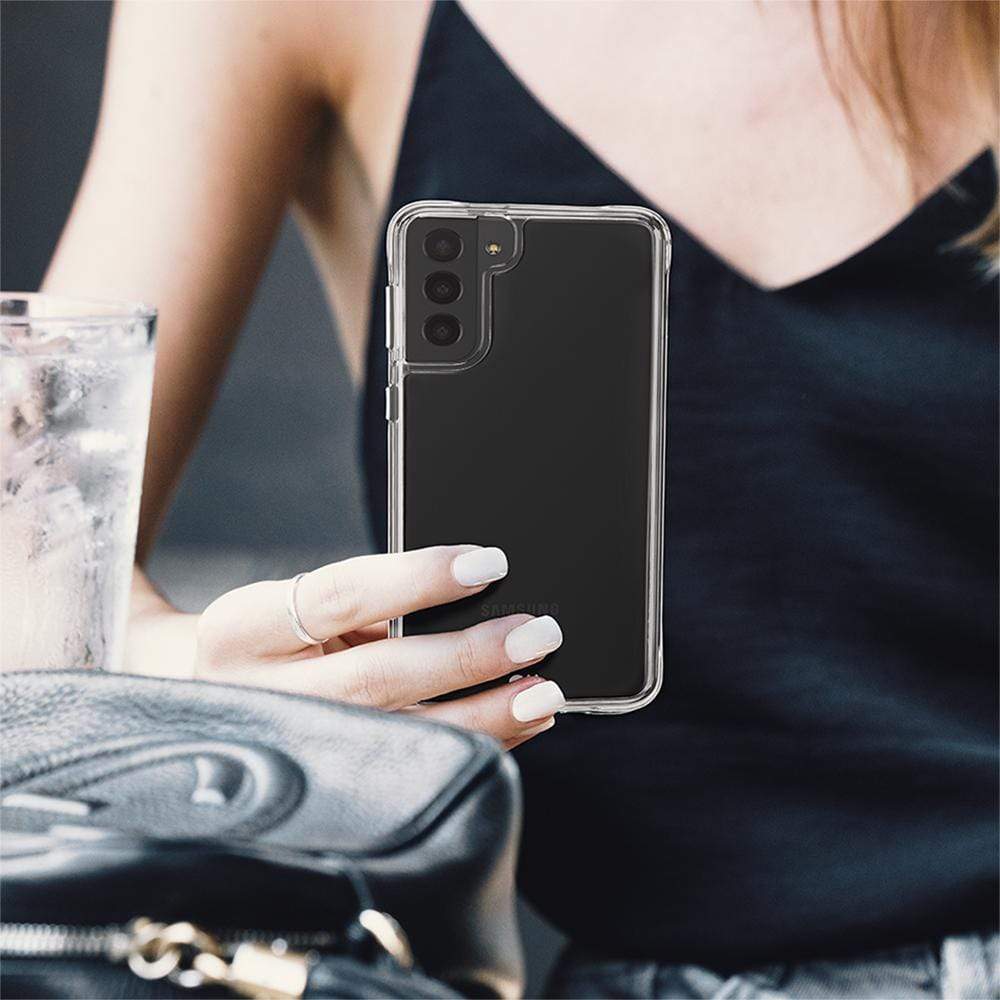 Woman holding tough clear case. color::Clear