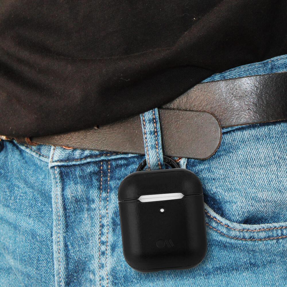 Black Leather AirPods case hooked onto belt loop. color::Black