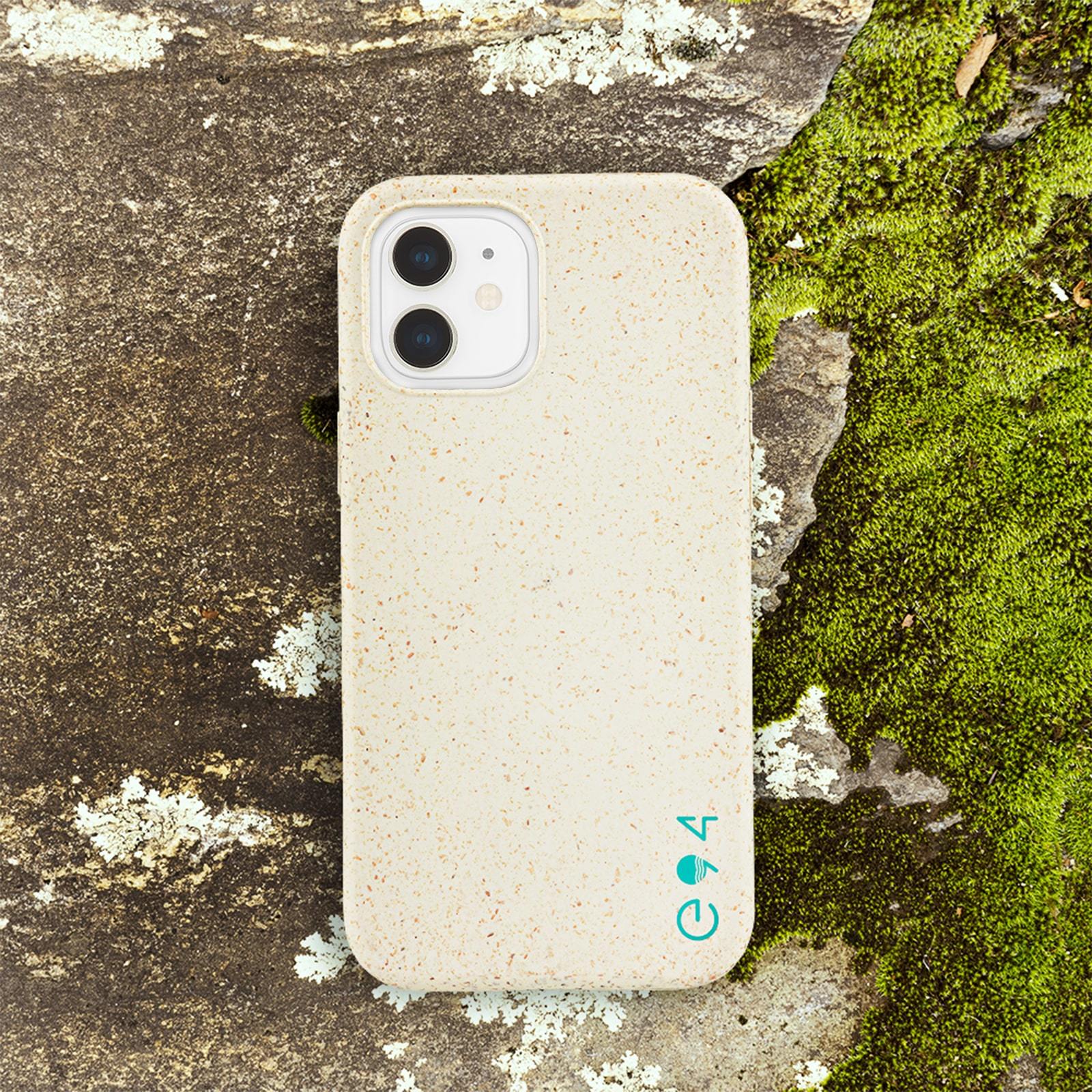 ECO 94 Biodegradable iPhone 12 Mini case sitting on mossy rock. color::Natural