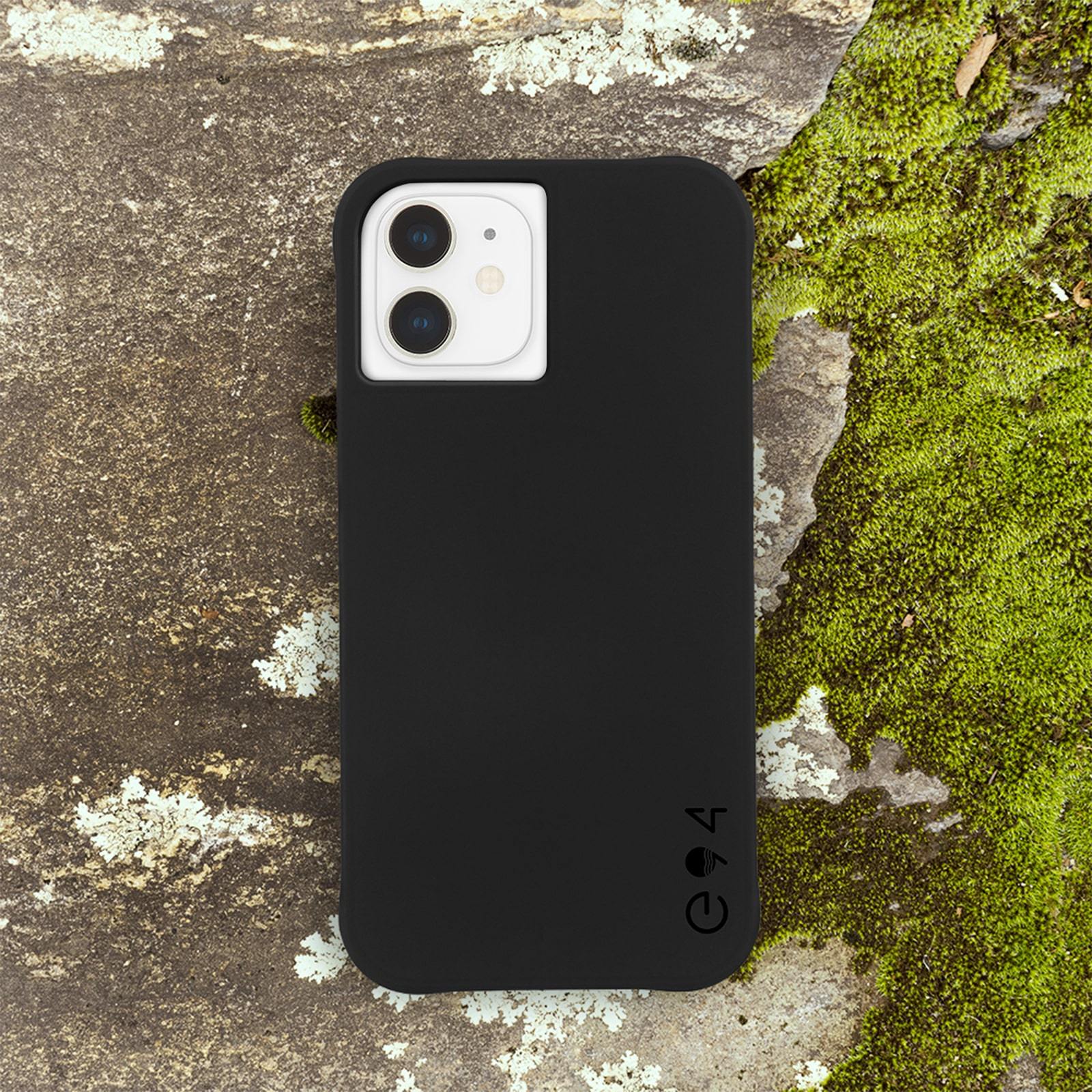 Recycled black iPhone 12 Mini case sitting on mossy rock. color::Black