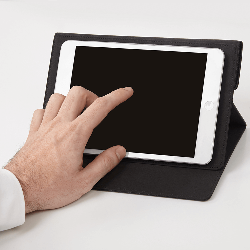 Hand touching iPad inside Black Venture Folio. color::Black