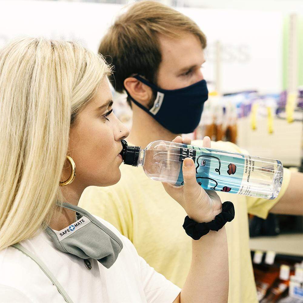 Woman and man wearing cloth face masks while running errands. color::Multicolor