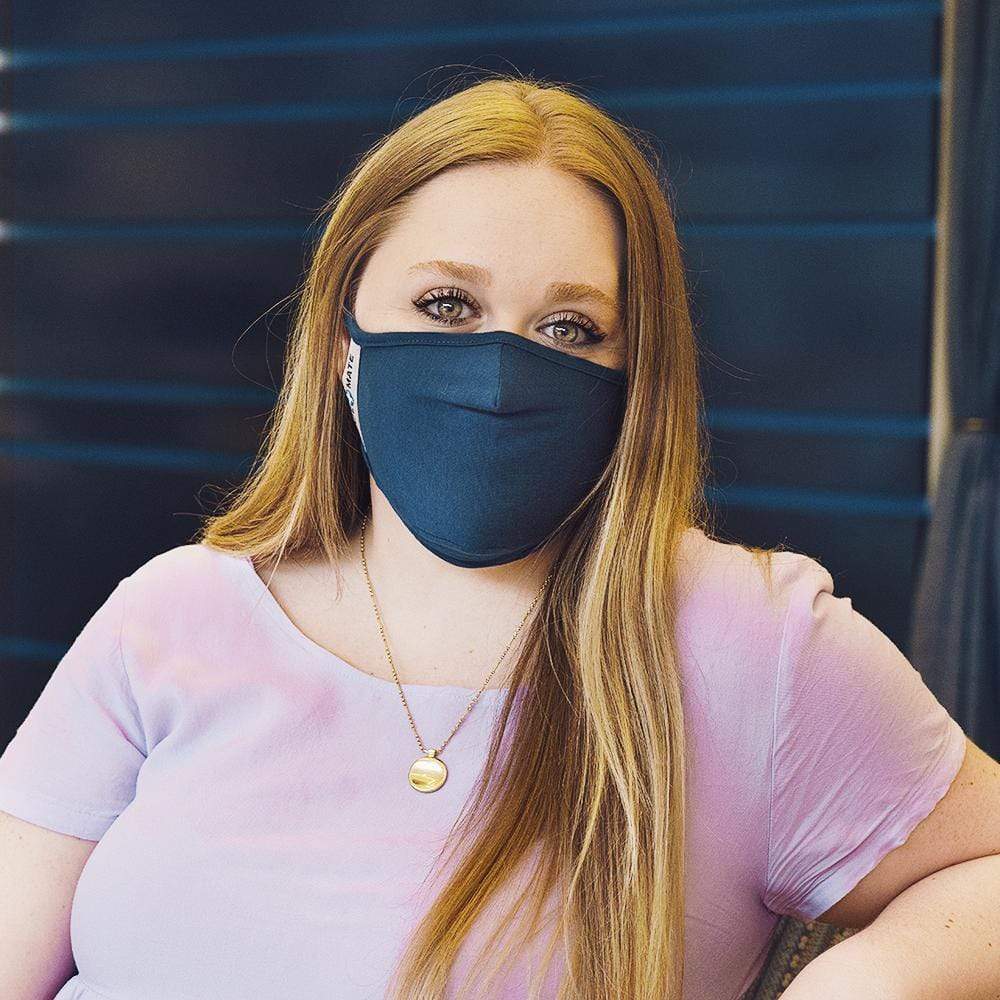 Woman wearing Navy Blue cloth face mask. color::Navy Blue