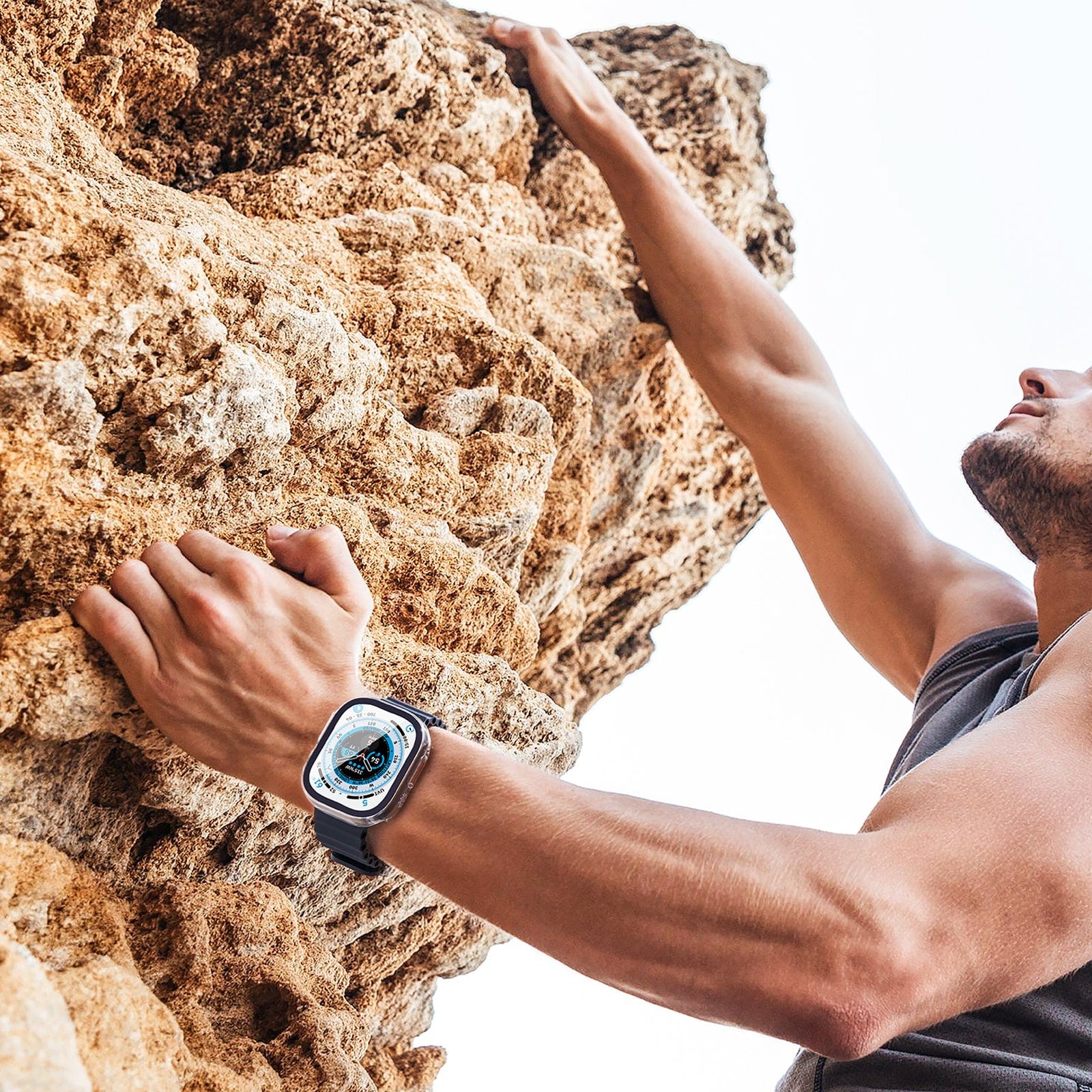 Man rock climbing with Ultra Apple Watch on wrist with Tough Clear Case on it.