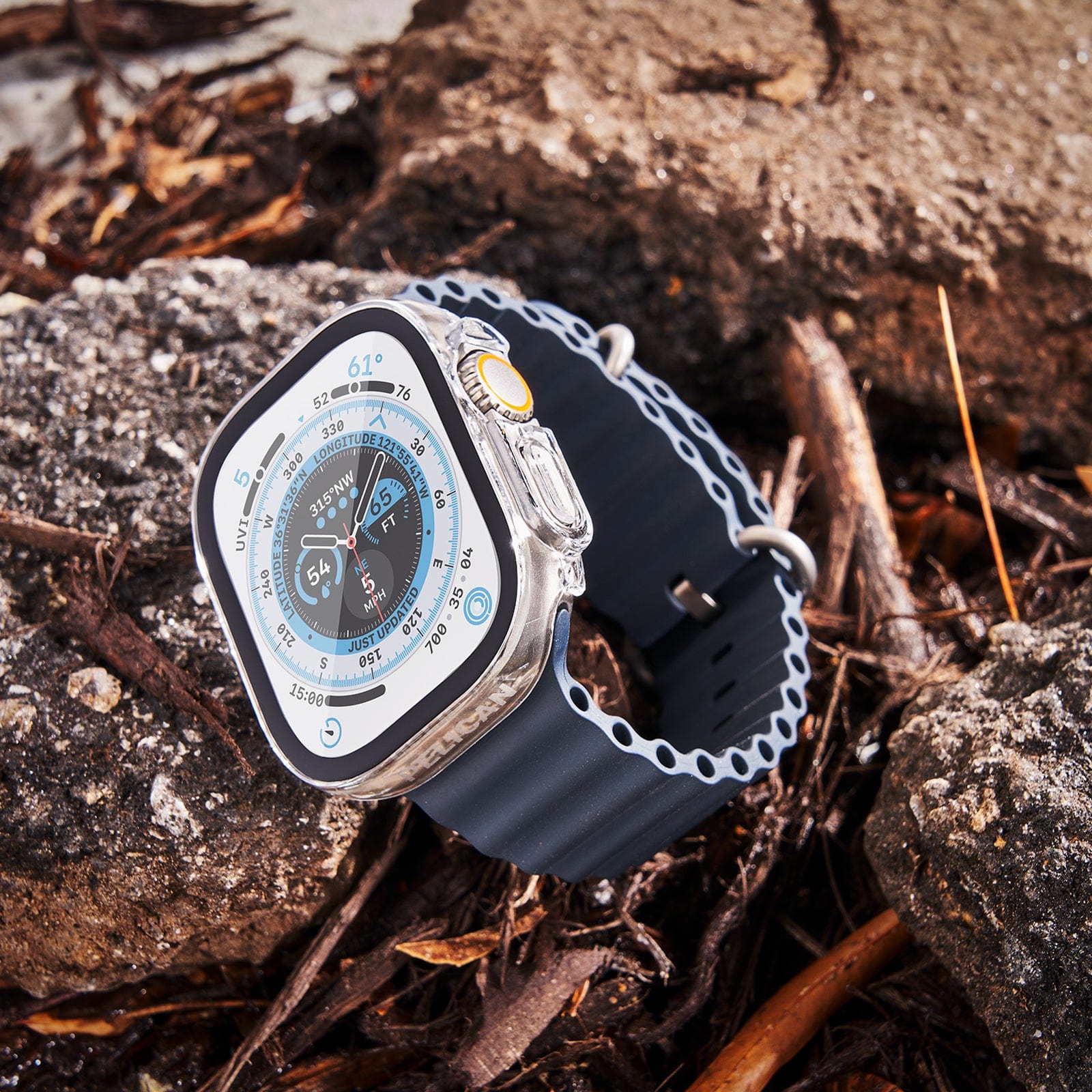 Apple Watch with Pelican Tough Clear Case on resting on top of rocks and twigs.