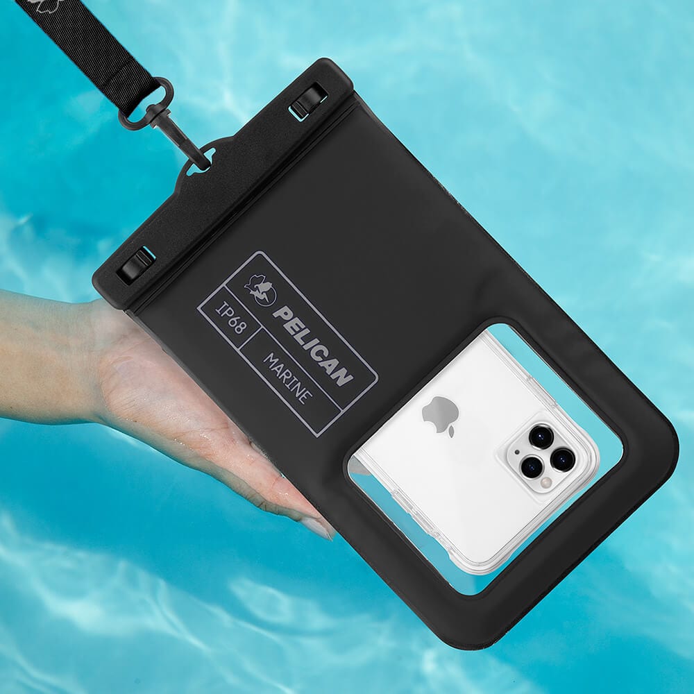 Black waterproof floating pouch with shoulder strap holding a white smartphone, displayed in water.