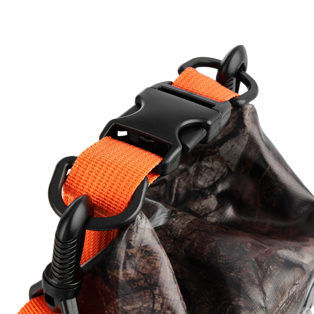Hunter camo dry bag with orange straps and black plastic hardware for carrying.
