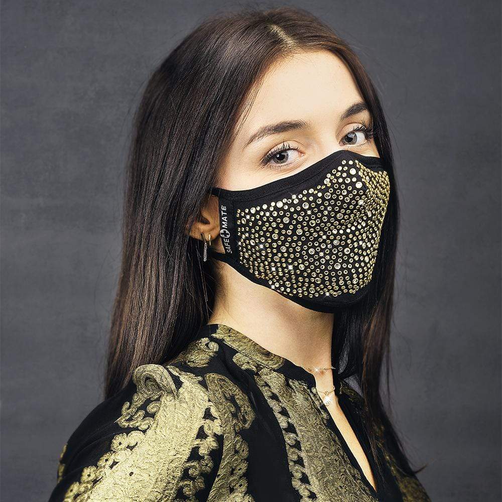 Woman wearing gold fashion mask. color::Gold