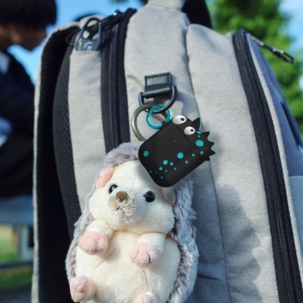 Spike attached to backpack with a stuffed animal. color::Spike