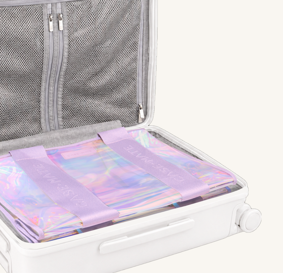 The jelly tote folded flat inside a suitcase